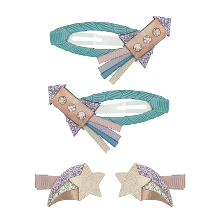 Set of decorative rocket hair clips with stars and ribbons on a white background