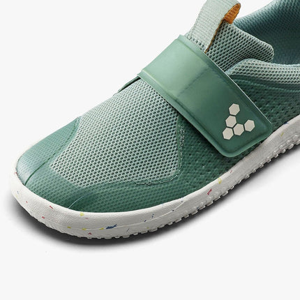 Green strap on shoes