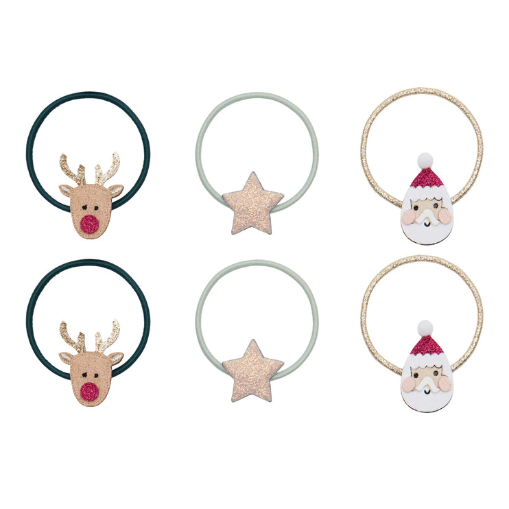Set of Christmas-themed hair ties with reindeer, star, and Santa Claus designs on a white background.