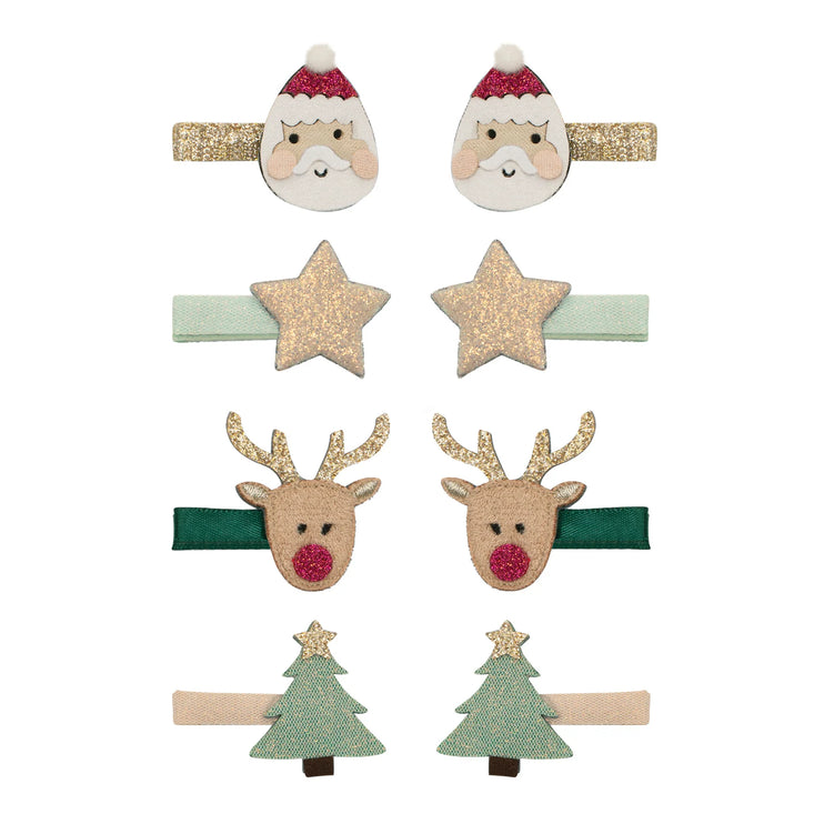 Set of Christmas-themed hair clips including Santa, reindeer, and tree designs on a white background.