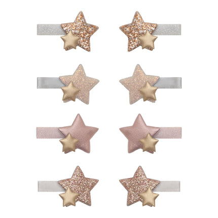 Set of six star-shaped hairbands with glittery stars on a white background