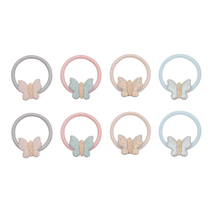Eight pastel-colored hair ponies.  Each ponies features a butterfly charm at the bottom, with different color combinations of pastel gray, pink, peach, and light blue, some with glittery textures.