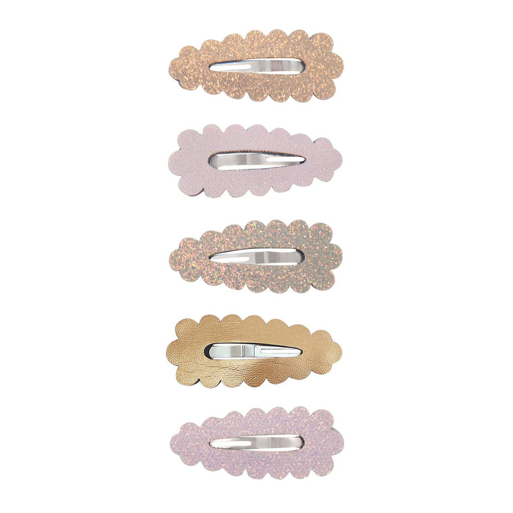 Set of five decorative hair clips with scalloped edges on a white background