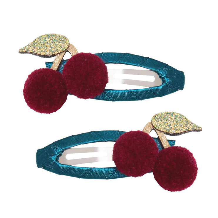 a hair clip with cherry design