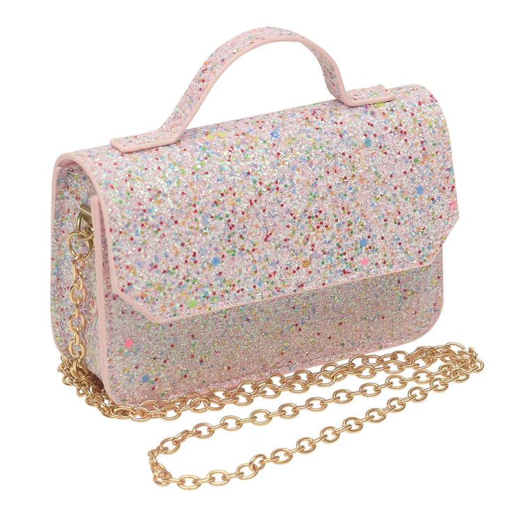 A small pink glitter handbag with a top handle, gold chain strap, and multicolor star and speckle glitter pattern