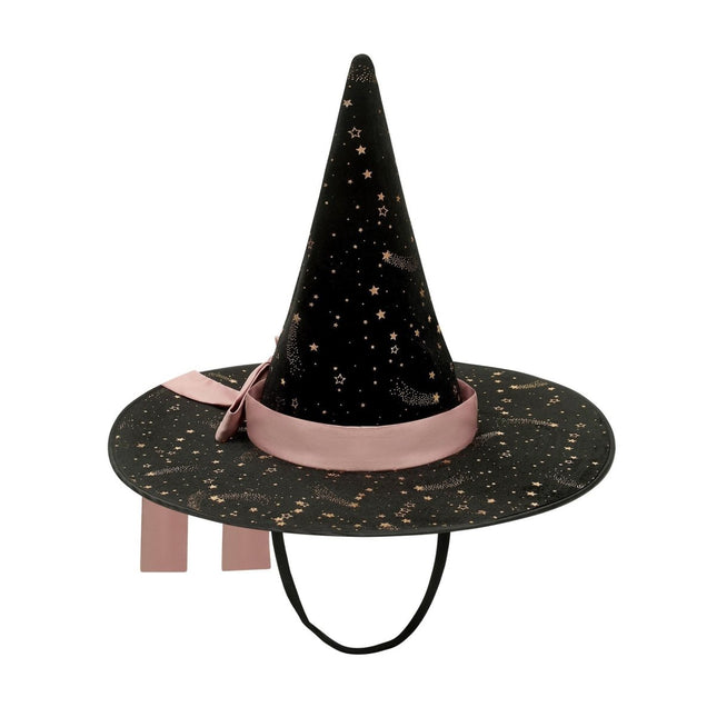 A black witch hat costume accessory with a pointed cone, wide brim, black elastic chin strap, and a dusty pink ribbon band decorated with small gold stars and crescent moon patterns.