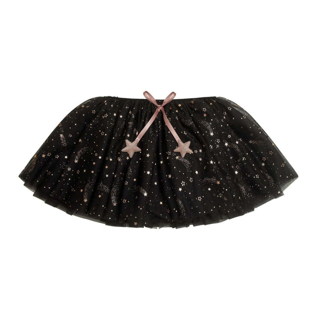 A black tutu skirt with a celestial print of stars, crescent moons, and sparkles, featuring a dusty pink ribbon bow at the waist with matching star-shaped ornaments.