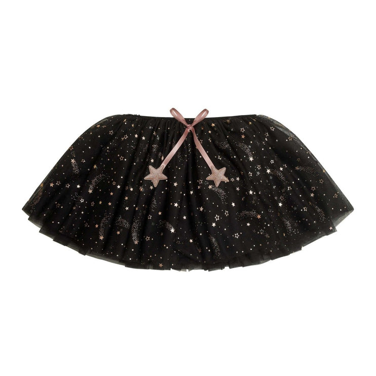 A black tutu skirt with a celestial print of stars, crescent moons, and sparkles, featuring a dusty pink ribbon bow at the waist with matching star-shaped ornaments.