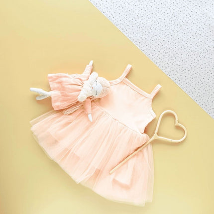tutu dress with wooden wand, and doll