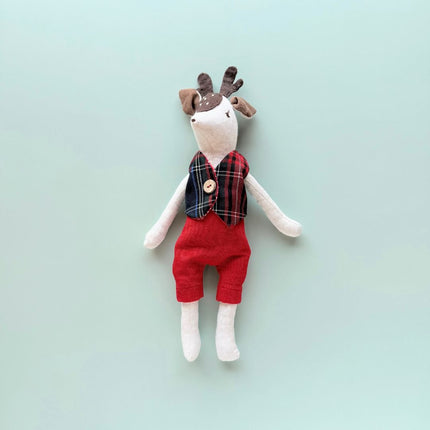 Rudi handmade reindeer doll wearing plaid festive vest and red pants
