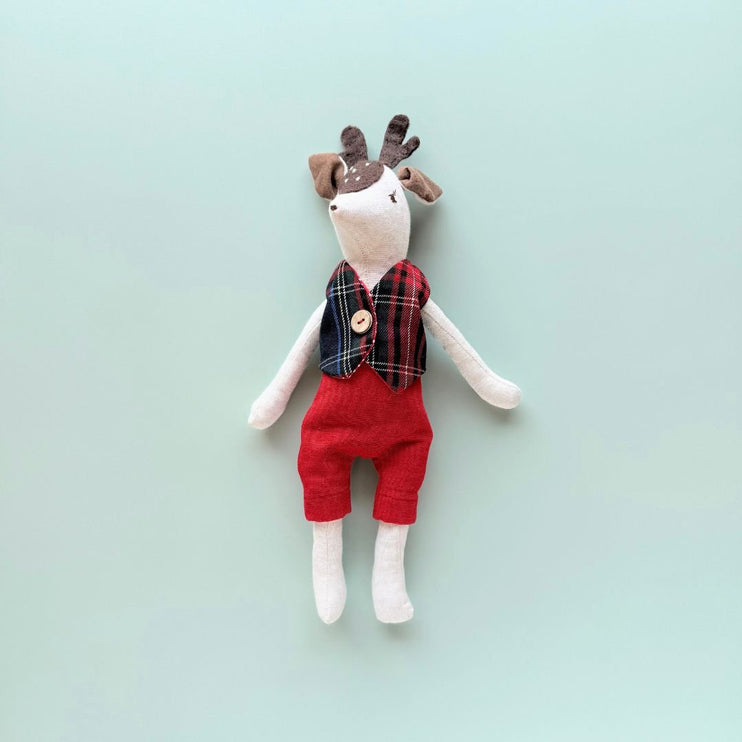 Rudi handmade reindeer doll wearing plaid festive vest and red pants