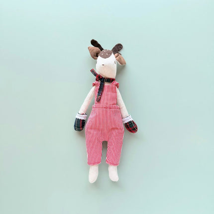 Remi handmade reindeer doll wearing red and white striped overalls and festive gloves and scarf. 