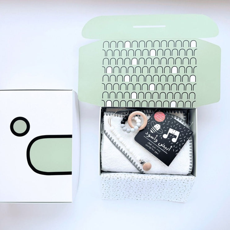 Baby gift set with blanket, rattle, and book in a gift box 