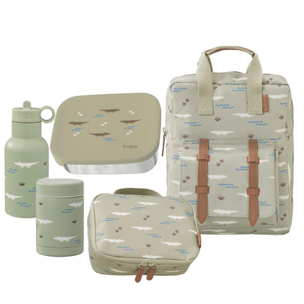 Set of green and beige bags and containers with nature-themed design on a white background