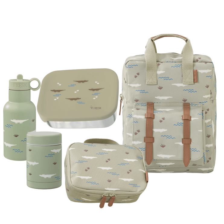 Set of green and beige bags and containers with nature-themed design on a white background