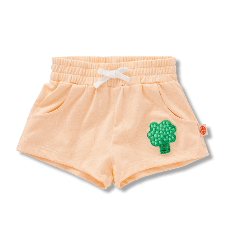 Peach-colored shorts with a green broccoli design 