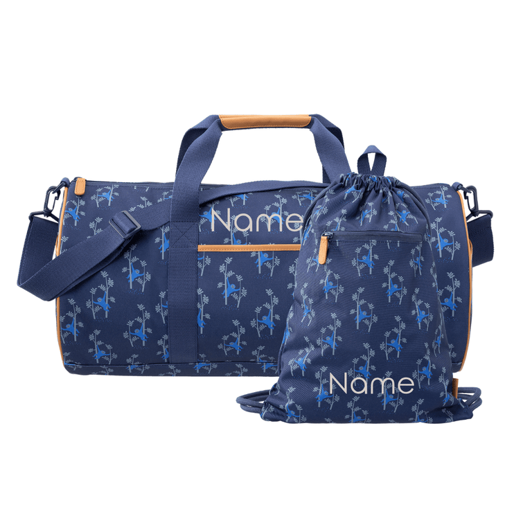 A navy blue duffel bag with a light blue monkey pattern with a swim bag. Both bags can be personalized
