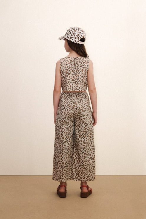 Leopard print outfit with wide-leg pants and a sleeveless top 