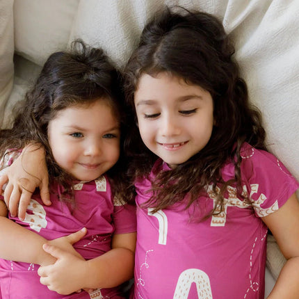 Siblings wearing matching Arqam short sleeve pajama