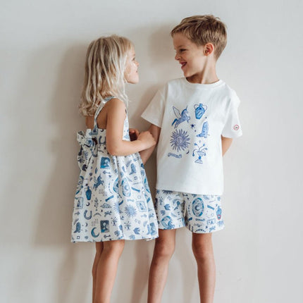 two children wearing matchy dress and shorts pattern