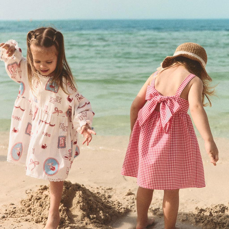 Two young girls in dresses 