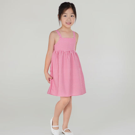 Young girl wearing a red  checkered dress 