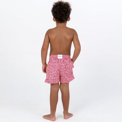 boy wearing the shorts coral reef