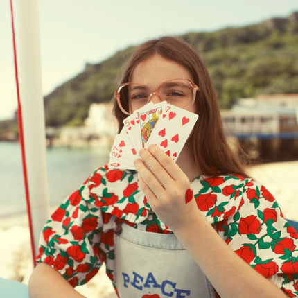 Girl wearing blouse with sailor collar with red roses
