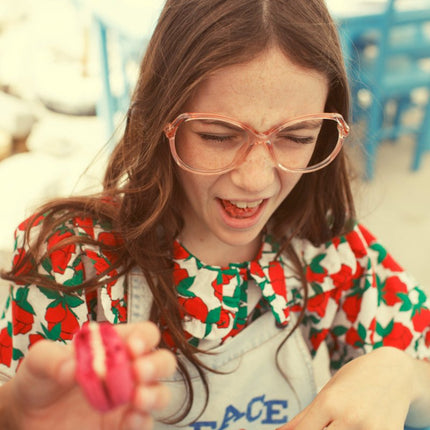 Girl wearing blouse with sailor collar with red roses