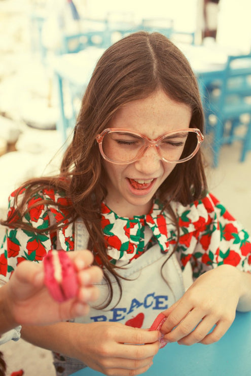 Girl wearing blouse with sailor collar with red roses