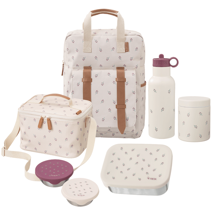 A coordinated insulated lunch set on a white background, including a backpack-style bag, lunch box, water bottle, storage container, and food containers. The items are cream/off-white with a small scattered berries print