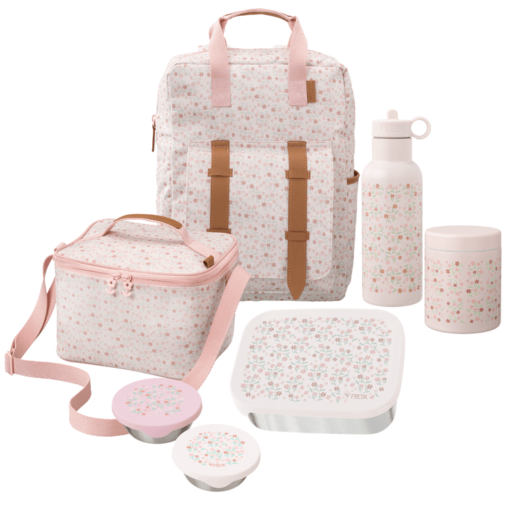 A coordinated school or picnic accessory set including a large backpack, a cooler bag, a water bottle, a lunch box with lid, a thermos food jar, and two snack boxes. The items are white with a small multicolor floral print and pink trim, with tan-brown strap accents.