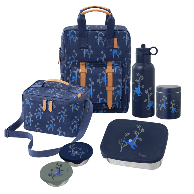 A coordinated school set on including a large backpack, a cooler bag, a water bottle, a lunch box with lid, a thermos food jar, and two snack boxes. The set is predominantly dark blue with a lighter blue monkey print.