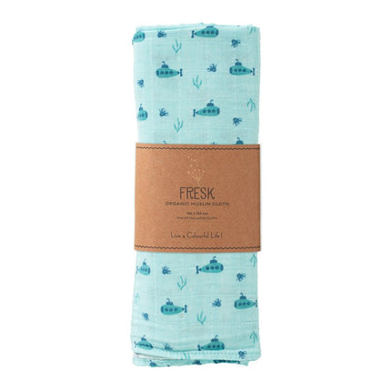 Folded organic swaddle with submarine pattern and brown label on a white background