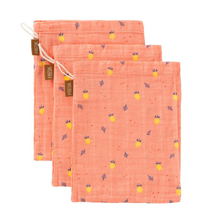 Set of three pink wash cloth with summer fruit pattern on a white background