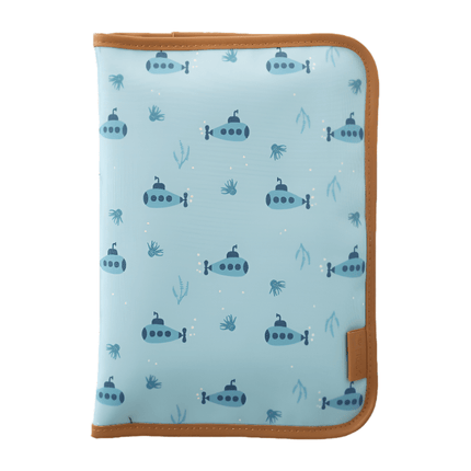 Folded light blue changing mat with a submarine pattern and brown edges.
