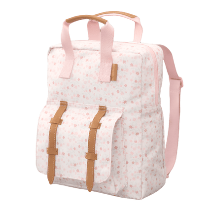 side look of the small backpack in garden flowers