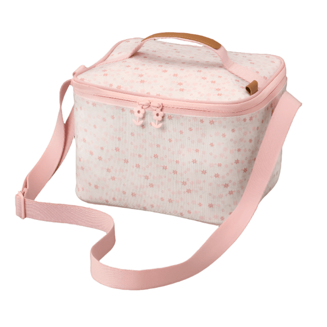 Cream lunch bag with tiny pink garden flowers, two zippers, and carrying straps.