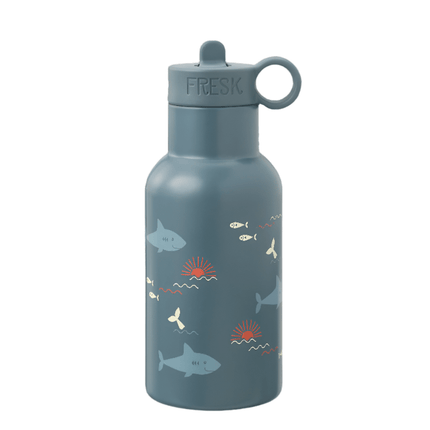 Navy Blue water bottle with a sharks and white fish and whale tail pattern and a navy blue flip-top lid with a carrying loop. The word "FRESK" is printed on the lid.

