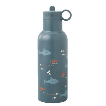 Large navy blue water bottle with a sharks and smal white fish and whale tail pattern and a navy blue flip-top lid with a carrying loop. The word "FRESK" is printed on the lid.
