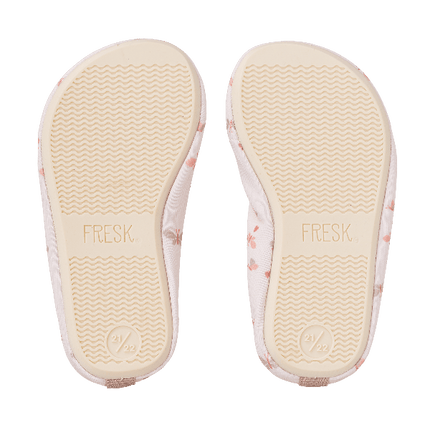 Cream swim shoes from Fresk with butterfly prints for girls with a flexible, grippy sole, reinforced toes, elastic fit, UV protection 50, and fast-drying fabric—perfect for sun-safe beach, pool, or indoor play.