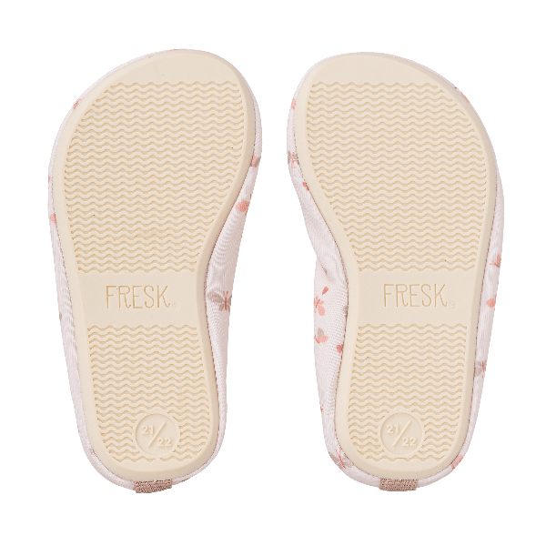Cream swim shoes from Fresk with butterfly prints for girls with a flexible, grippy sole, reinforced toes, elastic fit, UV protection 50, and fast-drying fabric—perfect for sun-safe beach, pool, or indoor play.