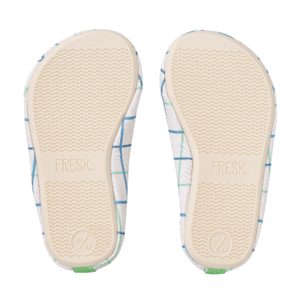 Cream swim shoes for boys with a flexible, grippy sole, reinforced toes, elastic fit, UV protection 50, and fast-drying fabric—perfect for sun-safe beach, pool, or indoor play.
