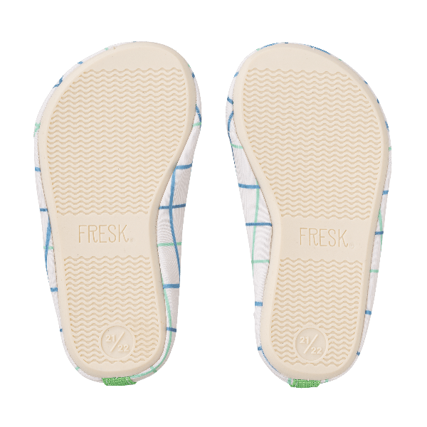 Cream swim shoes for boys with a flexible, grippy sole, reinforced toes, elastic fit, UV protection 50, and fast-drying fabric—perfect for sun-safe beach, pool, or indoor play.