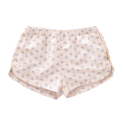 Peach with blue floral print swim shorts for girls made from eco-friendly recycled nylon, with UV Protection 50 and an adjustable drawstring—perfect for safe, comfy, and stylish beach fun.
 