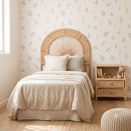 Bedroom with a bed featuring a wicker headboard and nightstand with books and a teddy bear.