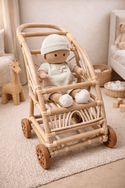 Toy baby in a wooden stroller in a nursery setting