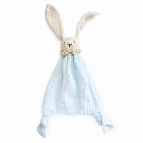 Knitted bunny toy with a blue checkered blanket on a white background