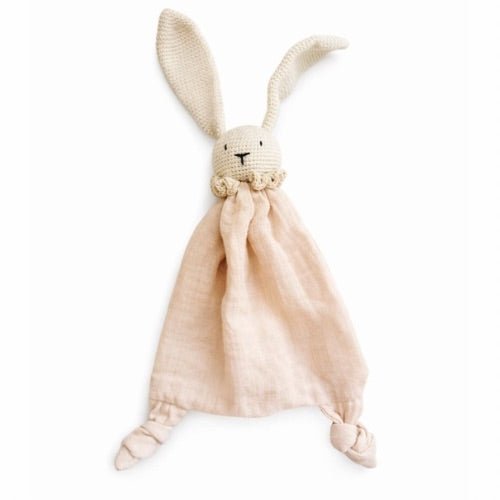 Knitted bunny plush toy with a beige blanket on a white background
