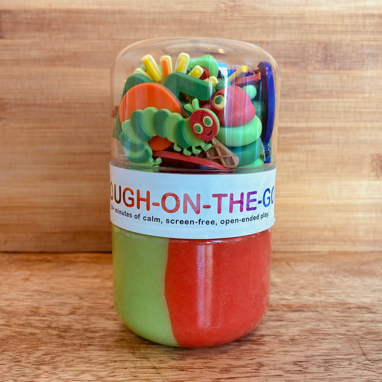 Colorful set of play dough tools in a container